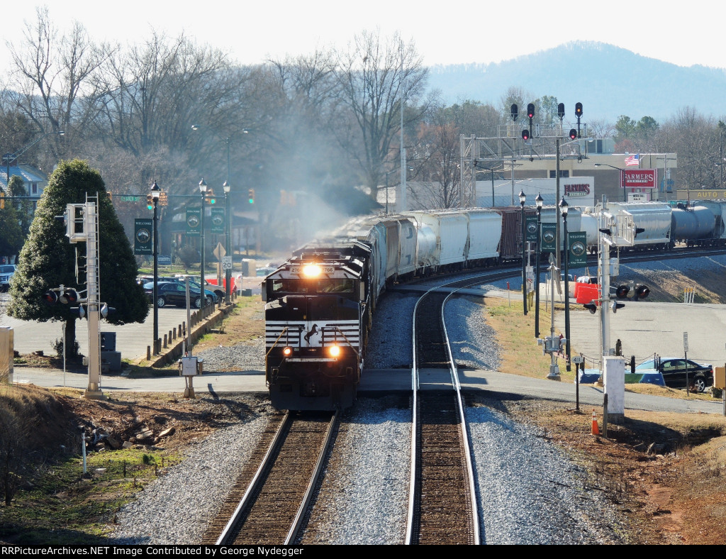 NS 2766 / SD70M-2 is leading a mixed freight train